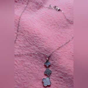 Ornate Silver Necklace with Intricate Pendant with clover